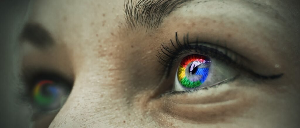 Close-up of a human eye reflecting the Google logo in its pupil, symbolizing the search engine's influence on online visibility and personal perception.