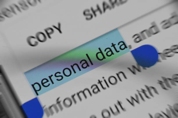 Identity theft risks highlighted through a focus on personal data on a digital screen.
