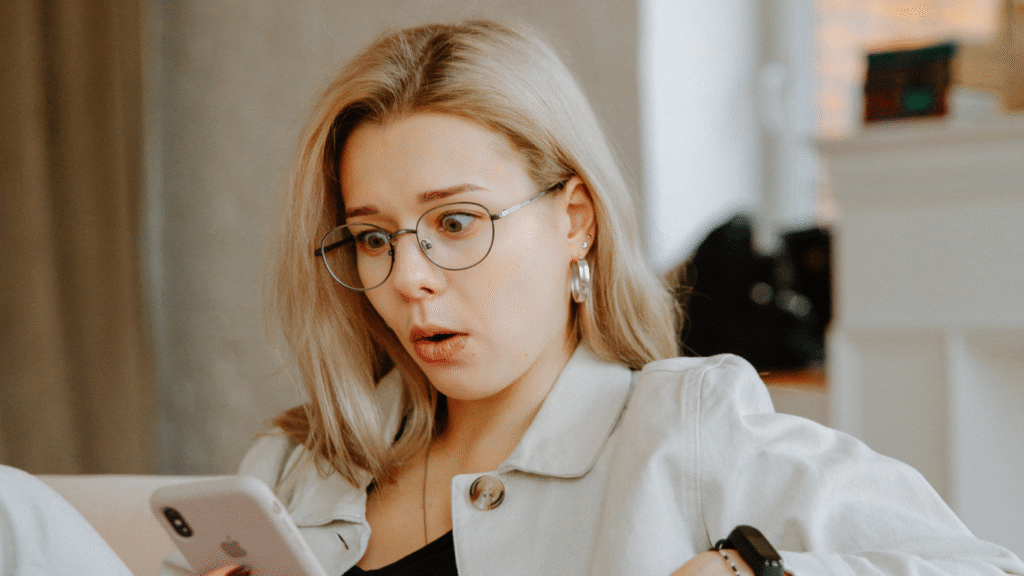 Worried woman reading fake news online affecting personal reputation