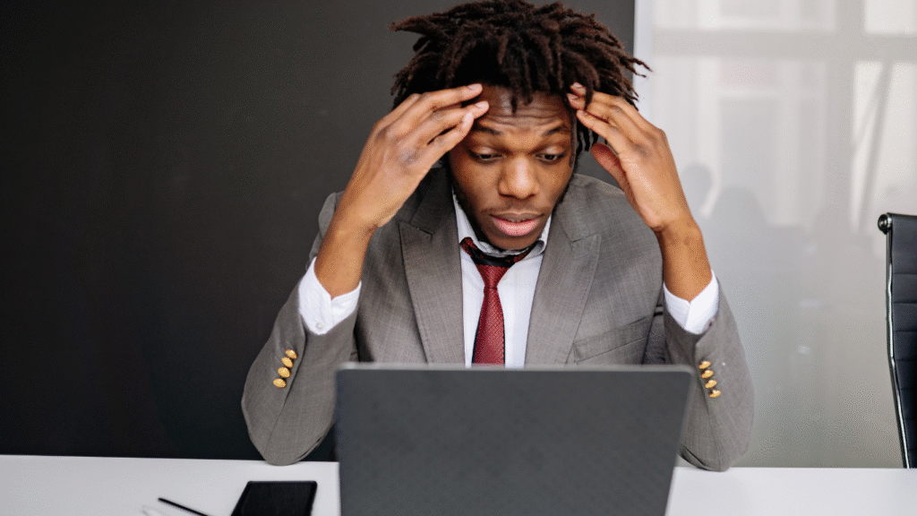 Business owner thinking of online reputation management in response to negative reviews